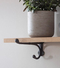 OAK SHELF WITH CAST IRON BRACKETS