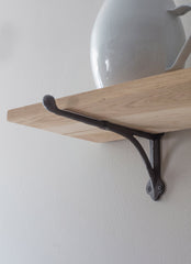 OAK SHELF WITH CAST IRON BRACKETS